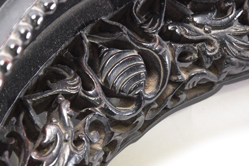 Lot 283 - A Chinese carved black wood triform stand,...