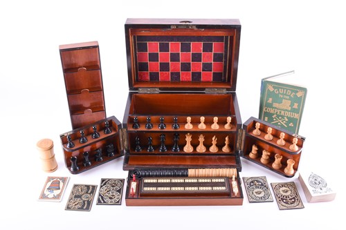 Lot 120 - A Victorian walnut veneered games compendium,...