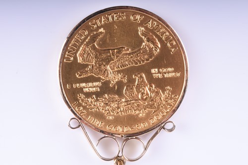 Lot 780 - An American 1oz Fine Gold 50 Dollar coin, 1986,...