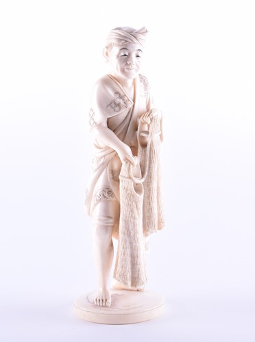 Lot 268 - A Japanese carved ivory okimono, Meiji period,...