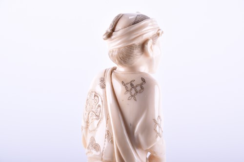 Lot 268 - A Japanese carved ivory okimono, Meiji period,...