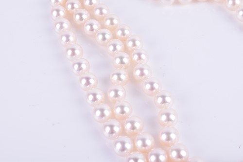 Lot 690 - A Bucherer Akoya triple strand pearl necklace,...