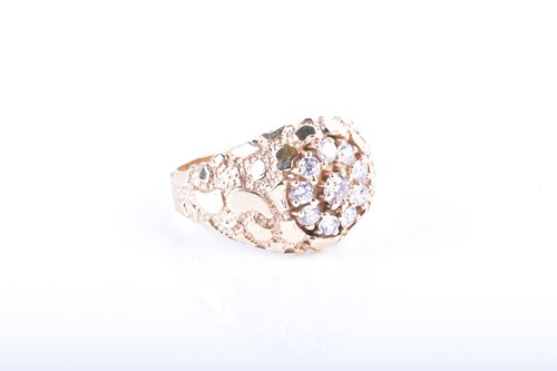 Lot 858 - A yellow metal and CZ ring set with a circular...