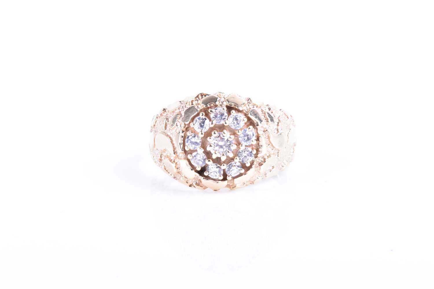 Lot 858 - A yellow metal and CZ ring set with a circular...