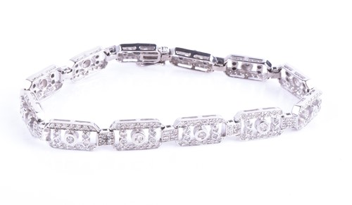 Lot 499 - A 14ct white gold and diamond bracelet, the...