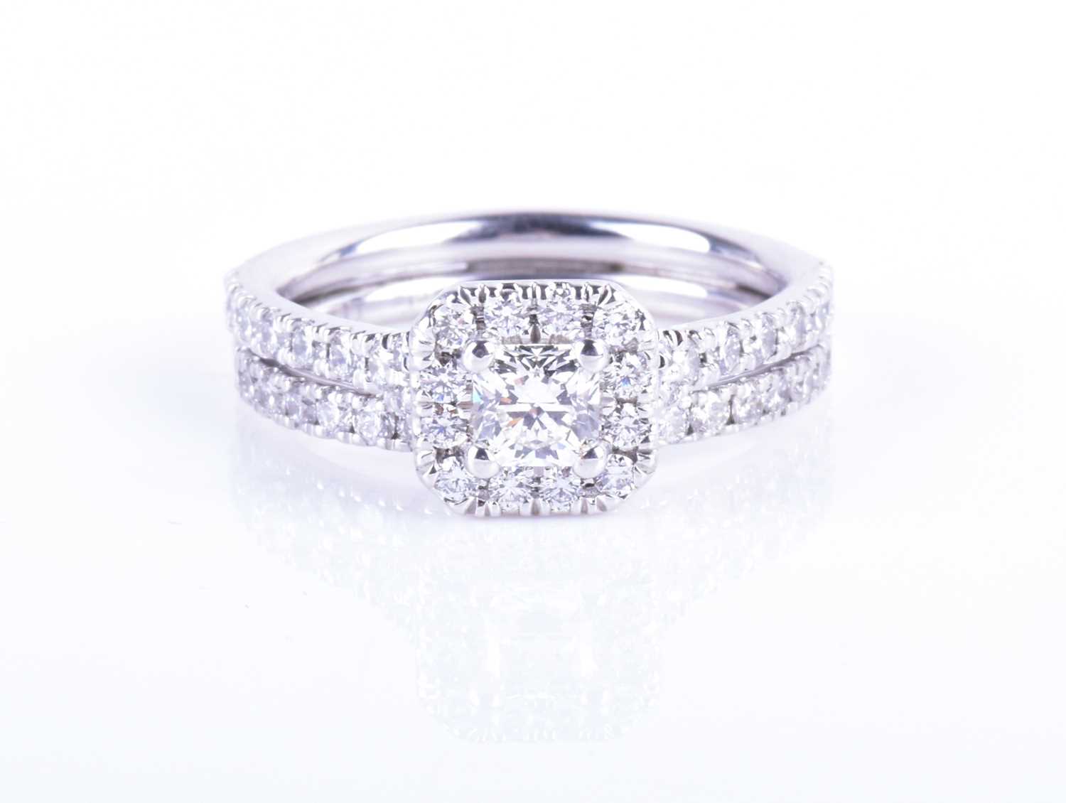 Lot 744 - A 14ct white gold and diamond ring by Hearts...