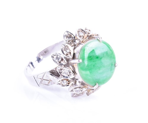 Lot 582 - A diamond and jade cocktail ring the raised...