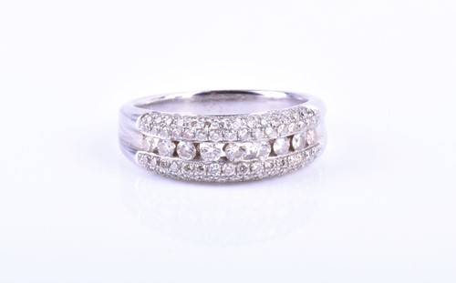 Lot 906 - A diamond triple row band ring channel set to...