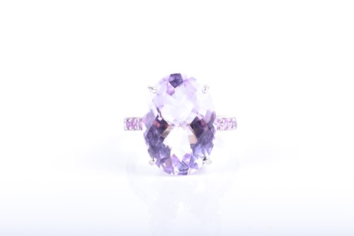 Lot 660 - A white gold, kunzite, and pink sapphire ring...