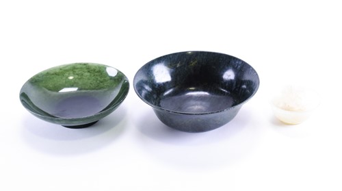 Lot 281 - A mutton fat jade tea bowl, late Qing, 5.5cm...