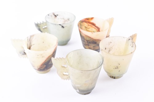 Lot 131 - Five Chinese carved soapstone cups with six...