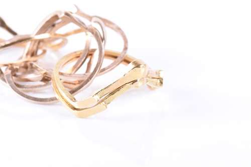 Lot 914 - A yellow metal puzzle ring comprising of eight...