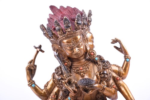 Lot 118 - A Tibetan gilt bronze and jewelled figure of...