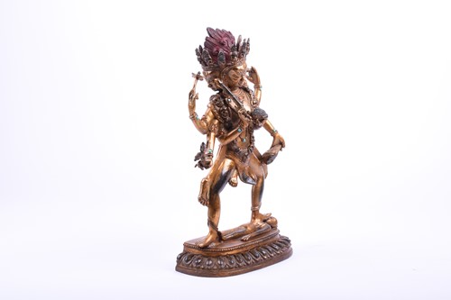 Lot 118 - A Tibetan gilt bronze and jewelled figure of...