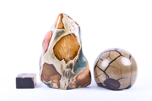 Lot 352 - A septarian polished stone sphere, 13 cm high,...
