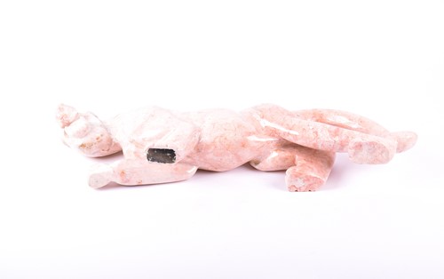 Lot 286 - A large pink hardstone model of a panther n...