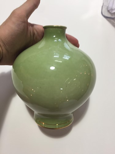 Lot 239 - An early 20th century Sevres green glazed vase...