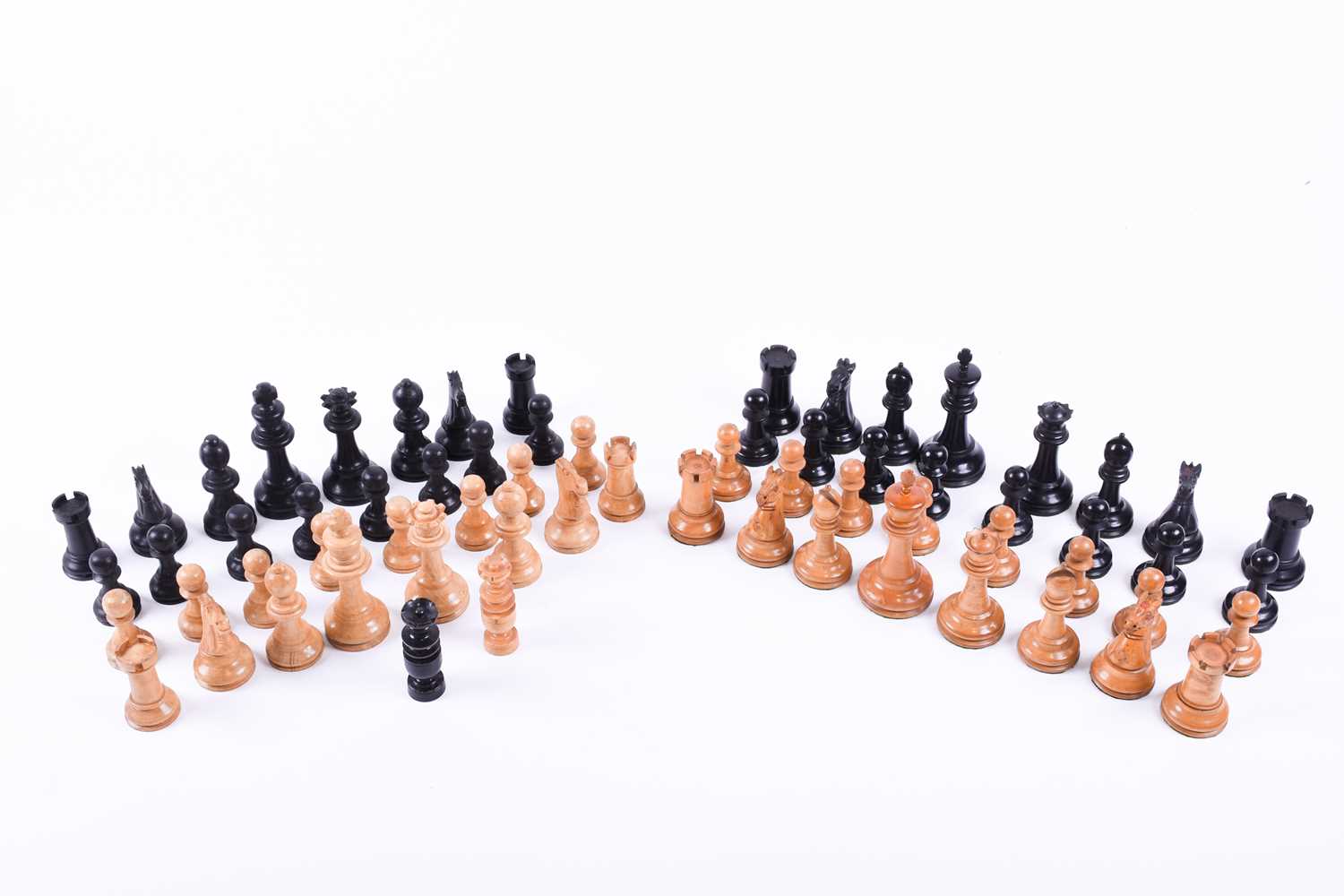 Lot 324 - A Staunton carved wood chess set, the rooks