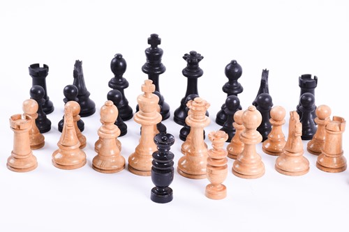 Lot 324 - A Staunton carved wood chess set, the rooks...