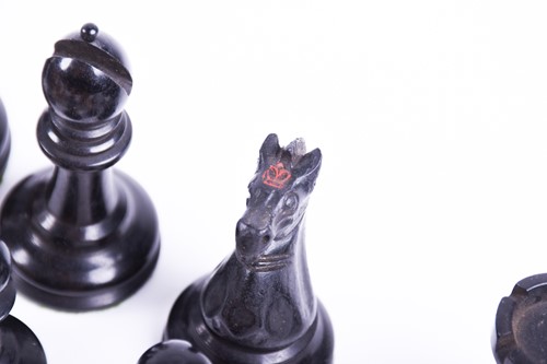 Lot 324 - A Staunton carved wood chess set, the rooks...
