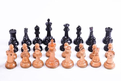 Lot 324 - A Staunton carved wood chess set, the rooks...