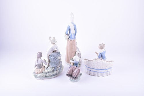 Lot 220 - Two Lladro figures comprising a young...