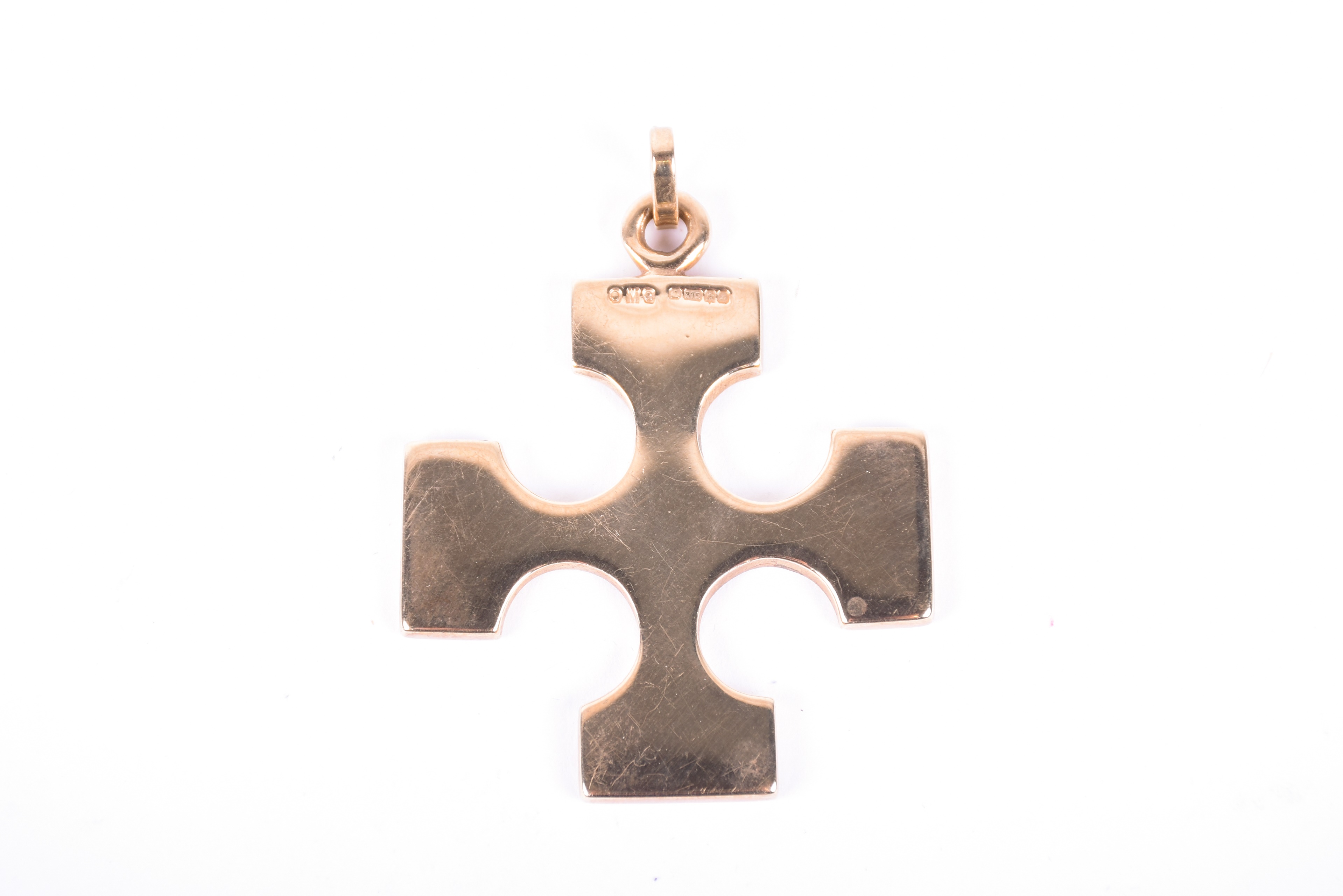 Lot 554 A 9ct gold cross pendant designed by Ola