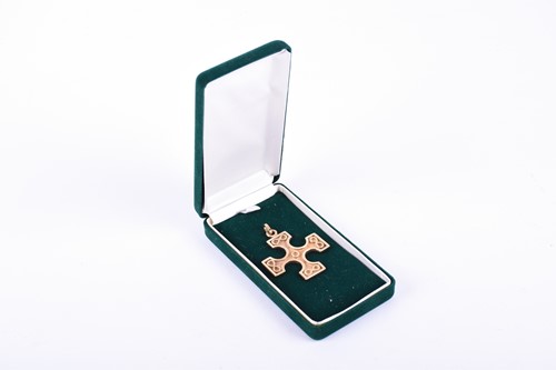 Lot 554 - A 9ct gold cross pendant designed by Ola Gorie,...