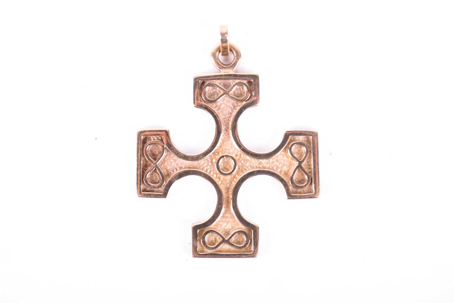 Lot 554 - A 9ct gold cross pendant designed by Ola Gorie,...