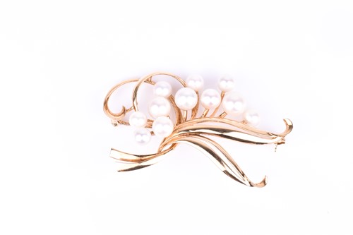 Lot 564 - A 14k yellow gold and pearl spray brooch by...