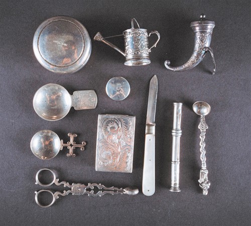 Lot 472 - An interesting collection of small silver and...