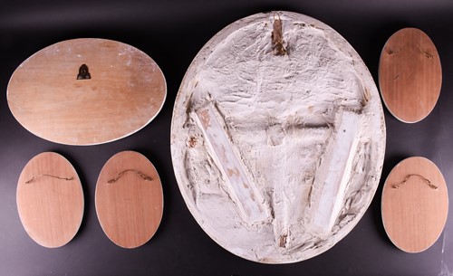 Lot 252 - A large 18th century style oval plaster relief...