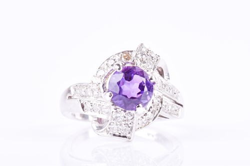 Lot 644 - A diamond and amethyst cocktail ring the...