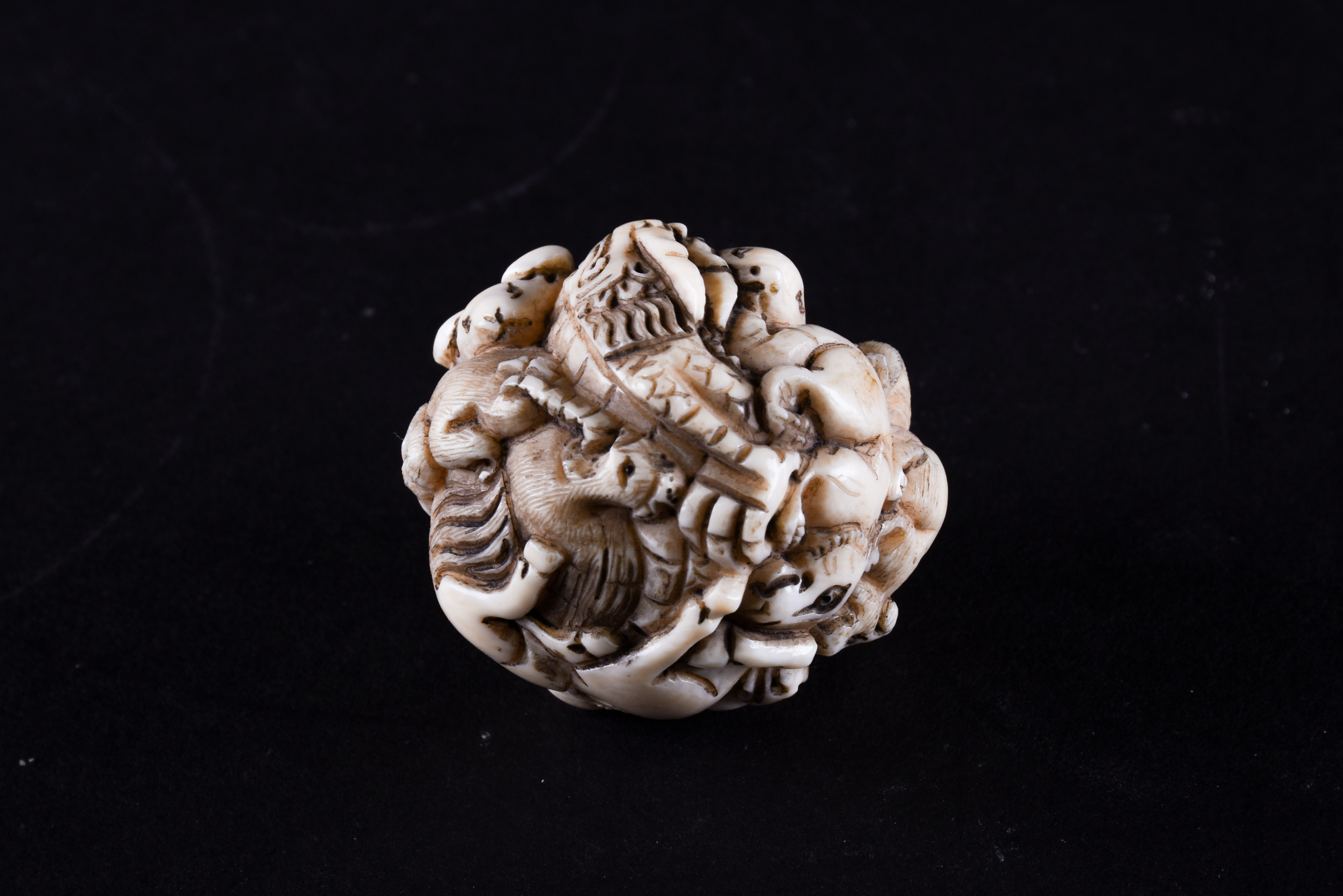 Lot 141 - A Japanese ivory zodiac ball netsuke, late