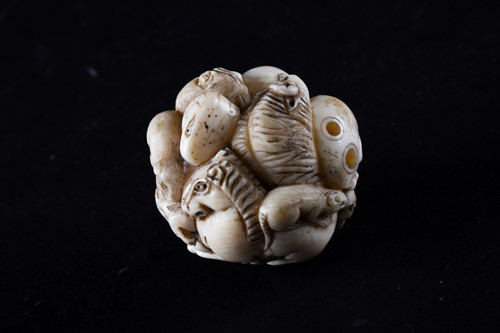 Lot 141 - A Japanese ivory zodiac ball netsuke, late...