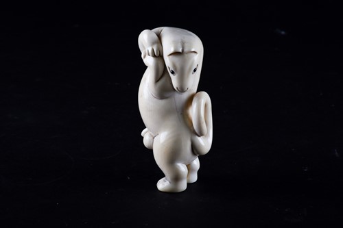 Lot 187 - A Japanese carved ivory okimono of a dancing...