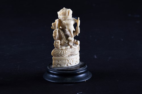 Lot 193 - A 19th century carved ivory figure of Ganesh,...