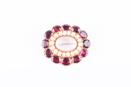 Lot 520 - A Victorian garnet, pearl, and rock crystal...