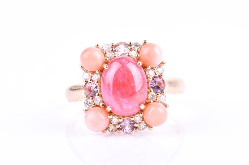 Lot 778 - A 14ct yellow gold, ruby, and coral ring...