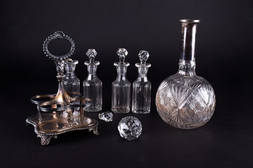 Lot 486 - A George IV silver four-bottle condiment stand,...