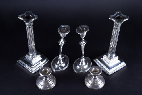 Lot 433 - Three pairs of silver candlesticks, comprising...