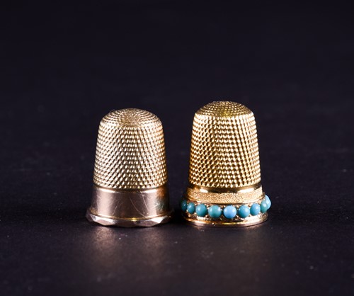 Lot 790 - A Victorian yellow metal thimble set with...