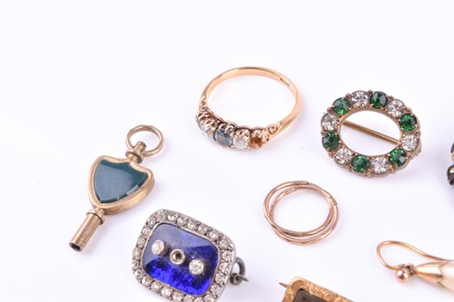 Lot 534 - A yellow gold, diamond, and green stone ring...