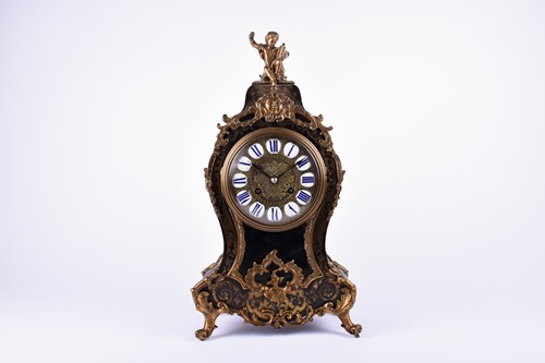 Lot 385 - A Louis XV style French mantel clock, in an...