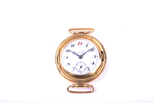 Lot 409 - A Cyma patent trench type wristwatch in 14k...