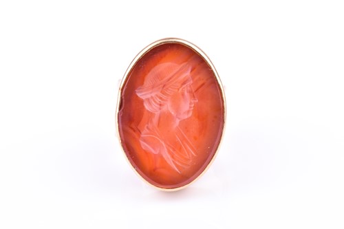 Lot 548 - A 9ct yellow gold and carnelian intaglio ring...