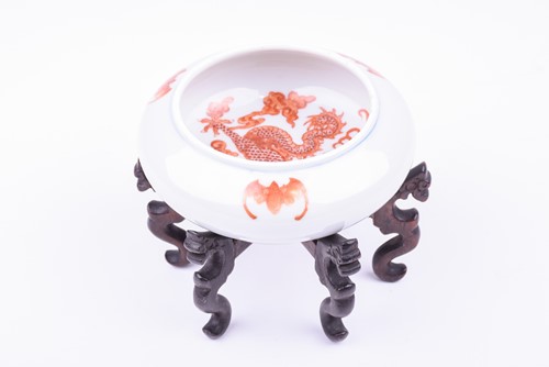 Lot 110 - A Chinese shallow dragon bowl, late Qing, the...