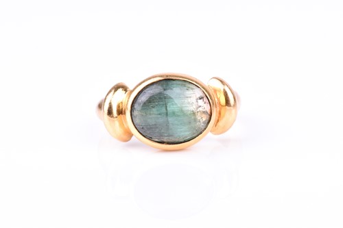 Lot 631 - A yellow gold and cats eye tourmaline ring set...