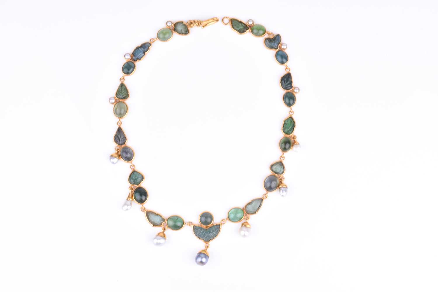 Lot 125 - An unusual yellow gold, green tourmaline, and...