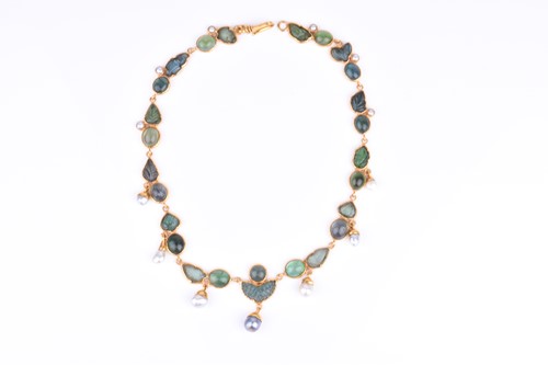 Lot 125 - An unusual yellow gold, green tourmaline, and...